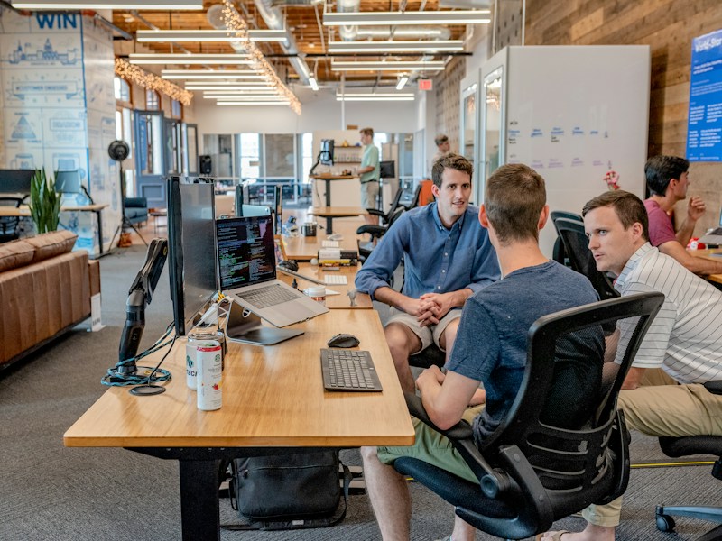 Colleagues sharing project progress openly